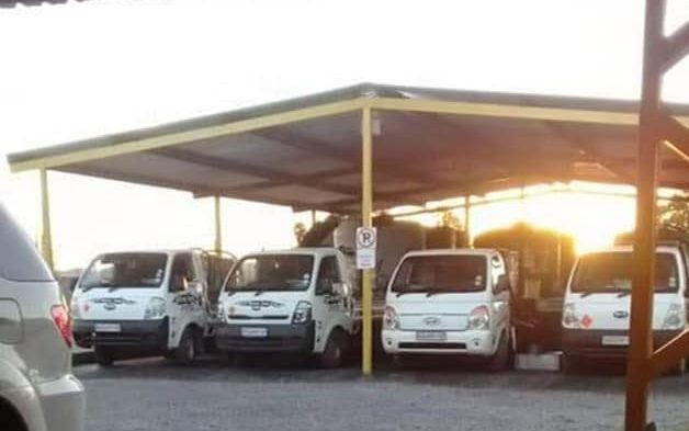 Old Oil Boys collection vehicles at the depot