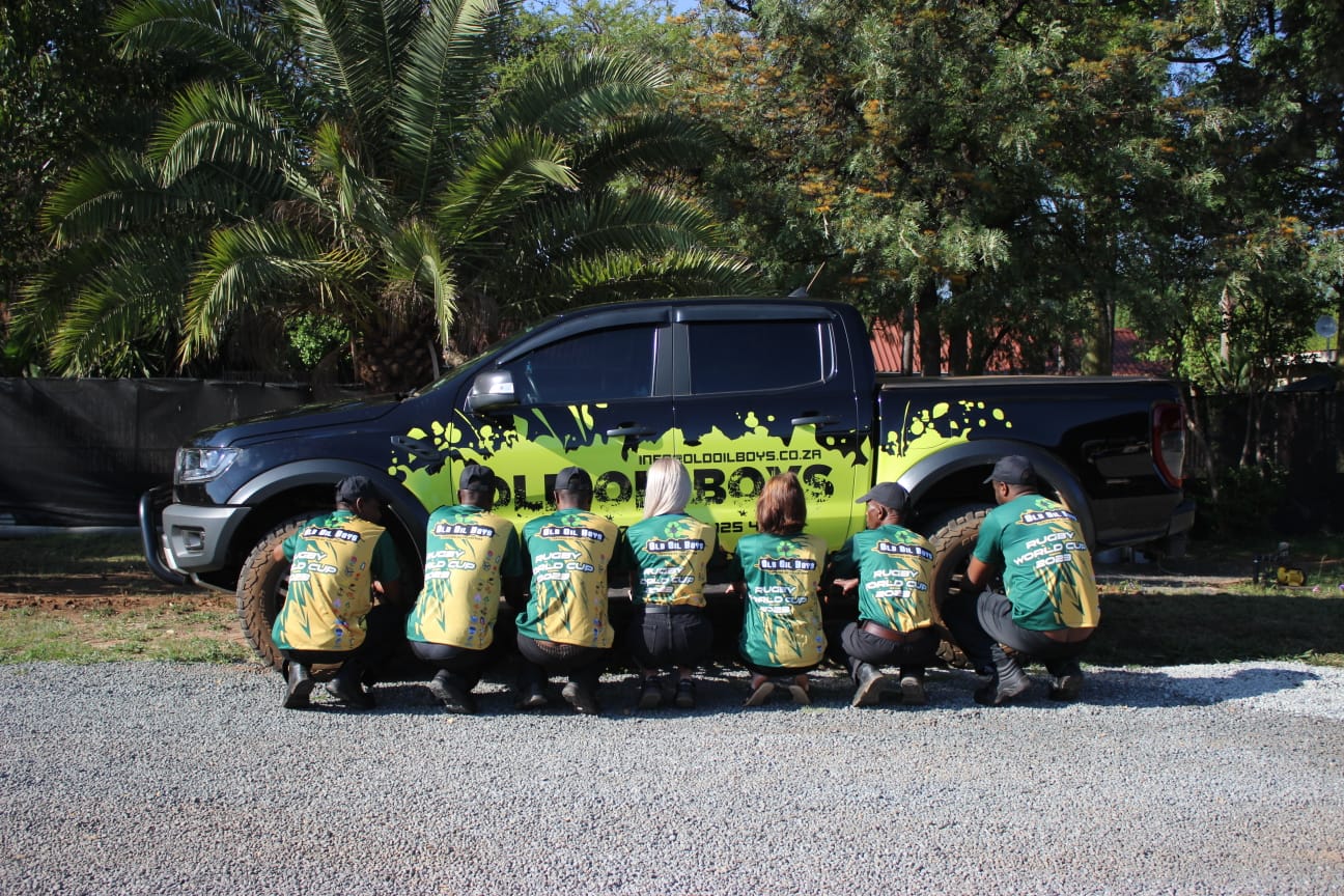 Old Oil Boys team with a branded vehicle